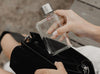 Original clear memobottle in A7 being put into a black handbag